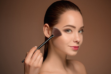 Image showing Beauty Girl with Makeup Brush. Perfect Skin. Applying Makeup