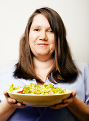 Image showing fat white woman having choice between hamburger and salad close 