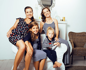 Image showing young pretty modern family at home happy smiling, lifestyle peop