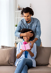 Image showing happy couple with gift box at home