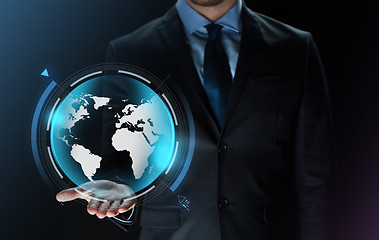 Image showing close up of businessman with earth projection