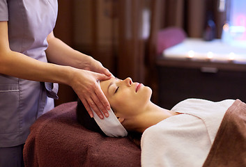 Image showing woman having face and head massage at spa