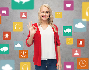 Image showing happy smiling young woman showing ok hand sign