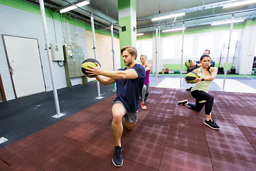 Image showing group of people with medicine ball training in gym