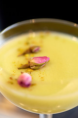 Image showing close up of glass with creamy cocktail at bar