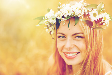 Image showing happy woman in wreath of flowers