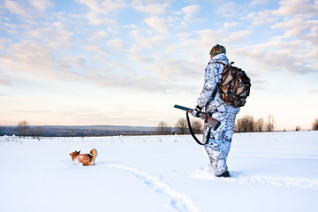 Image showing hunter with a dog on a frosty day