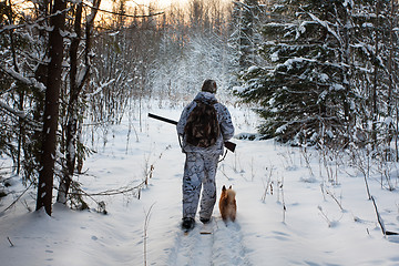 Image showing hunter comes out of the winter forest