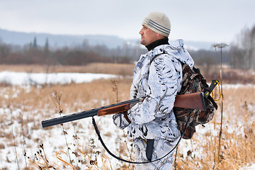 Image showing hunter on the snowy field