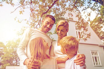 Image showing happy family in front of house outdoors