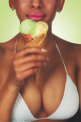 Image showing young black beautiful woman eating ice-cream