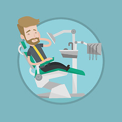 Image showing Man suffering from toothache in dental chair.