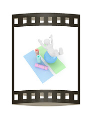 Image showing 3d man on a karemat with fitness ball. 3D illustration. The film