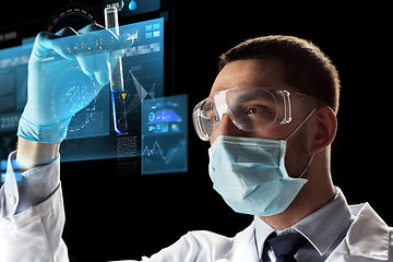 Image showing scientist with test tube and virtual screen