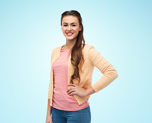 Image showing happy smiling young woman in cardigan