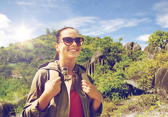 Image showing happy young woman with backpack traveling