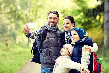 Image showing family taking selfie with smartphone in woods