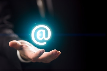 Image showing Man\'s hand holds internet sign