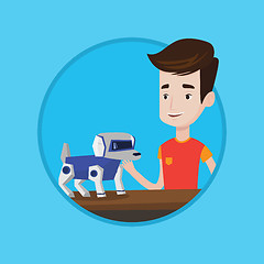 Image showing Happy young man playing with robotic dog.