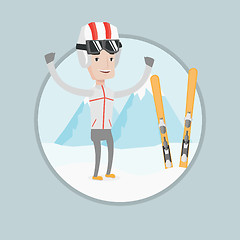 Image showing Cheerful skier standing with raised hands.