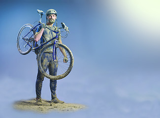 Image showing The man with bike in sand standing on abstract background. Collage