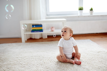 Image showing happy baby with soap bubbles at home
