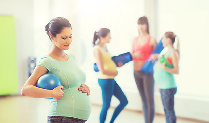 Image showing happy pregnant woman with ball in gym