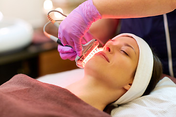 Image showing young woman having face microdermabrasion at spa