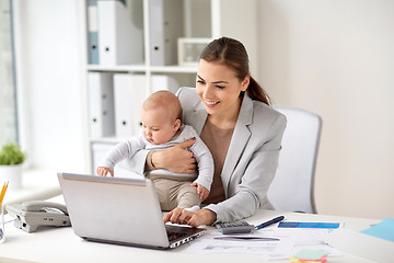 Image showing happy businesswoman with baby and laptop at office