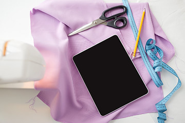 Image showing sewing machine, tablet pc, scissors and ruler