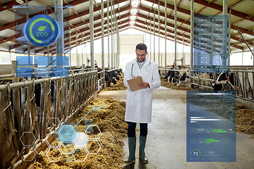 Image showing veterinarian with cows in cowshed on dairy farm