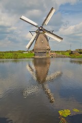 Image showing Windmill beside a canal
