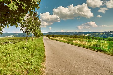 Image showing Countryside road in hilly landscpe