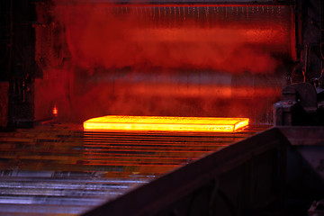 Image showing Hot steel on conveyor