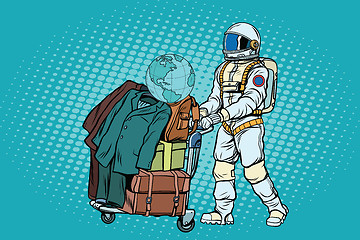 Image showing Astronaut traveler with baggage cart