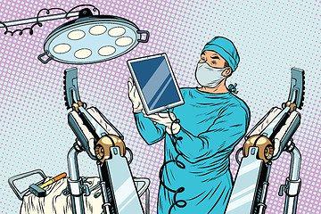 Image showing Obstetrician delivered a baby robot computer tablet