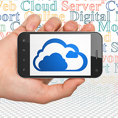 Image showing Cloud computing concept: Hand Holding Smartphone with Cloud on display