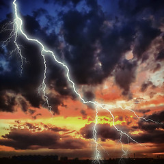 Image showing Night cityscape with strong lightning