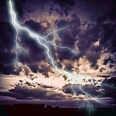 Image showing Night cityscape with strong lightning