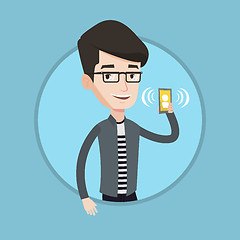 Image showing Man holding ringing mobile phone.