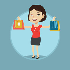 Image showing Happy woman holding shopping bags.