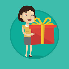 Image showing Joyful caucasian woman holding box with gift.