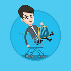 Image showing Happy man riding by shopping trolley.