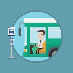 Image showing Caucasian bus driver sitting at steering wheel.