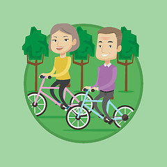 Image showing Happy senior couple riding on bicycles in the park