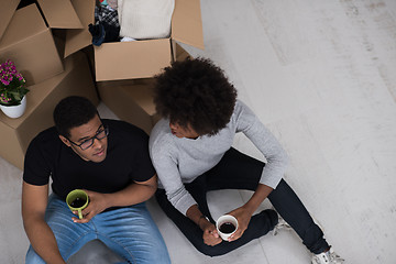 Image showing African American couple relaxing in new house