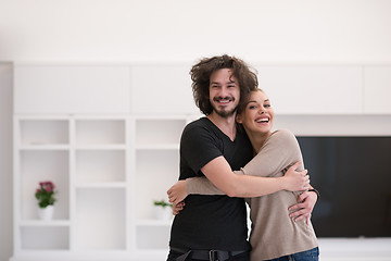 Image showing couple hugging in their new home