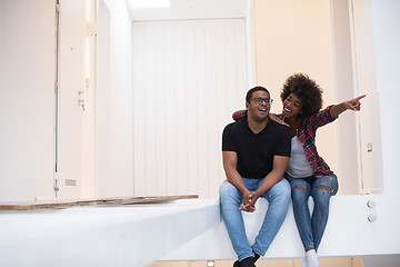 Image showing couple having break during moving to new house