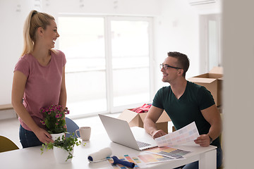 Image showing Young couple moving in a new home