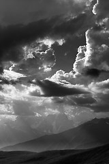 Image showing Black and white view on mountains in sunlight clouds